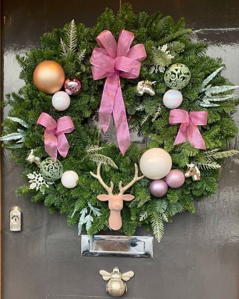 Christmas door decorating, xmas wreath by flowers by eg
